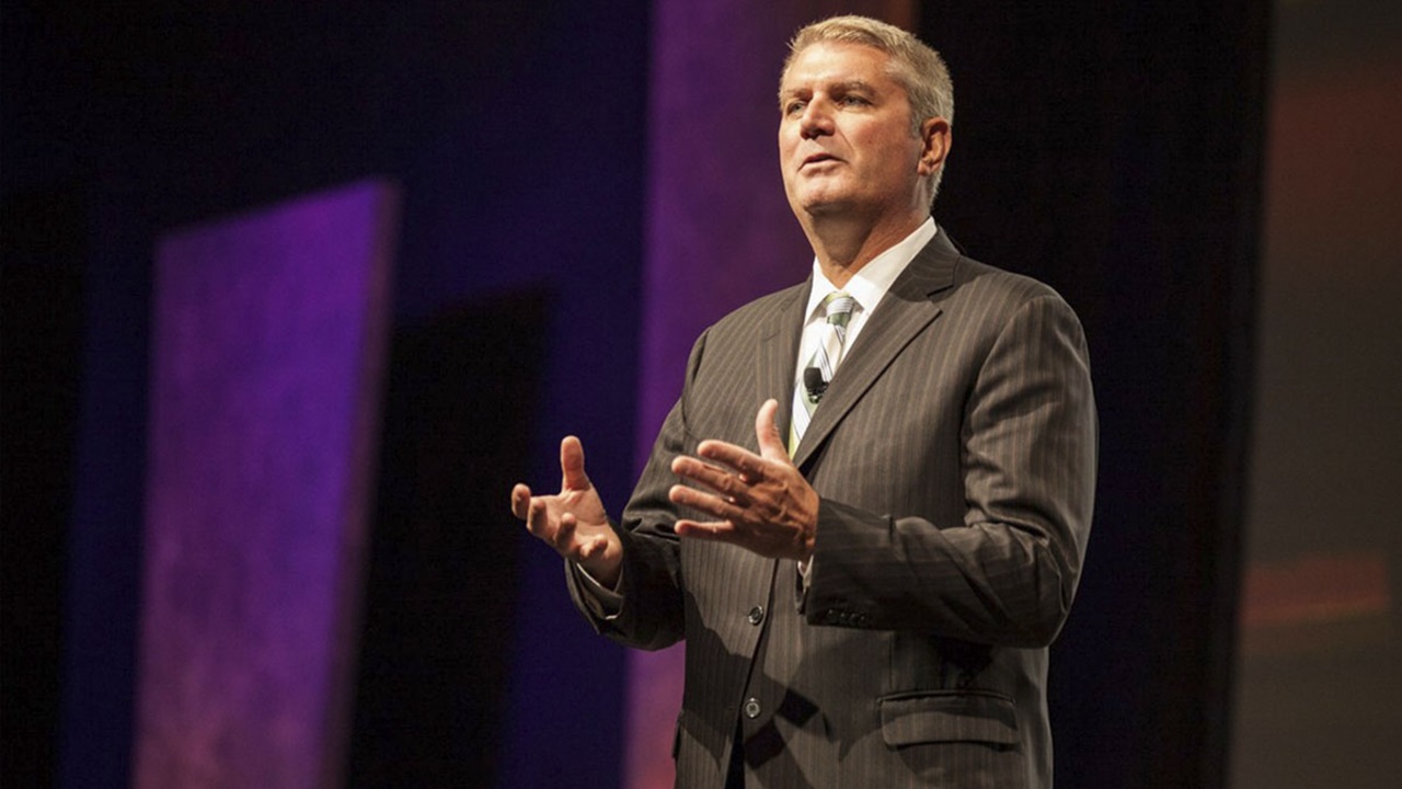 Michael Abrashoff speaking on stage Michael Abrashoff speaking on stage