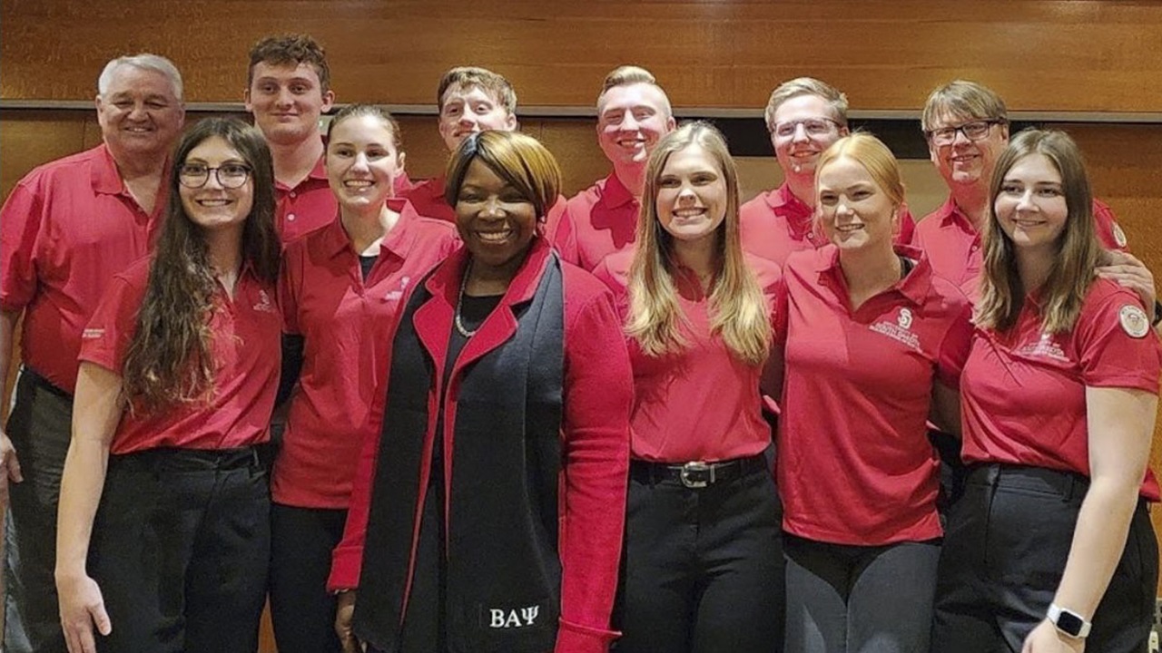 The USD Beta Alpha Psi honor organization standing together in a group. The USD Beta Alpha Psi honor organization standing together in a group.