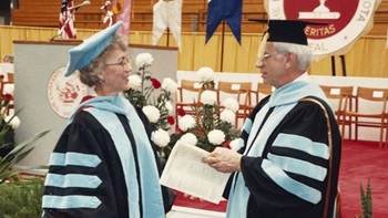 Dr. Marlys Ann Boschee and Dr. Floyd Boschee together in full graduation regalia.