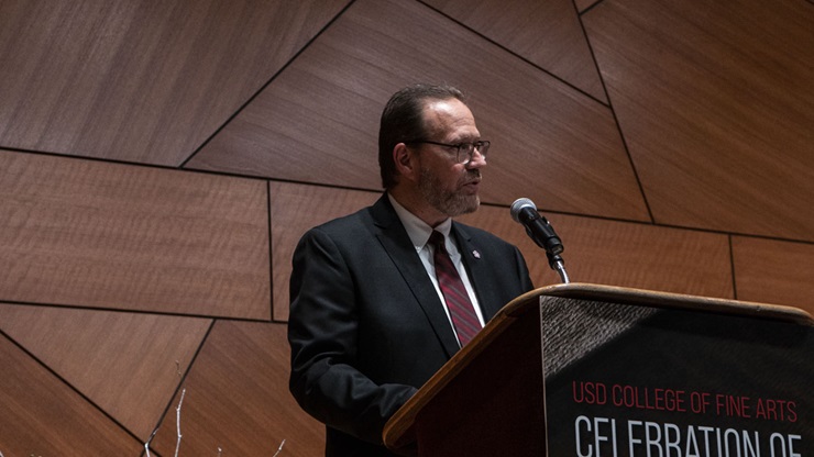 Bruce Kelley stands behind a lectern at the the 2022 Celebration of Excellence event. He is talking to the crowd. Bruce Kelley stands behind a lectern at the the 2022 Celebration of Excellence event. He is talking to the crowd.