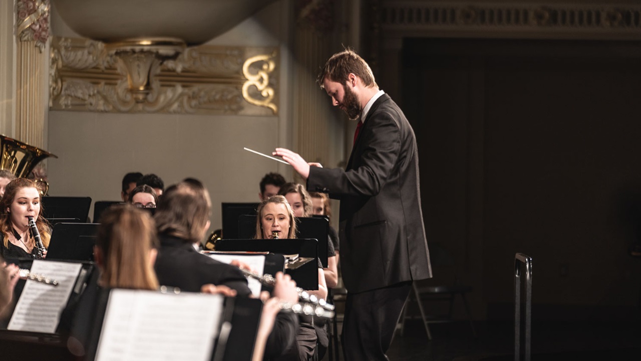 A director conducting an orchestra.