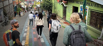 OT and PT students walking down a street in Guatamala.