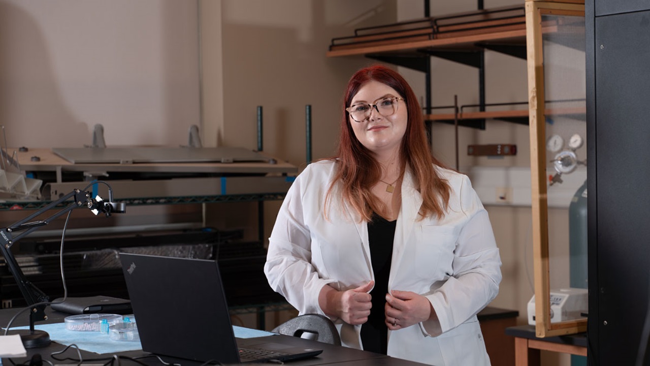Cassie Thompson standing in lab