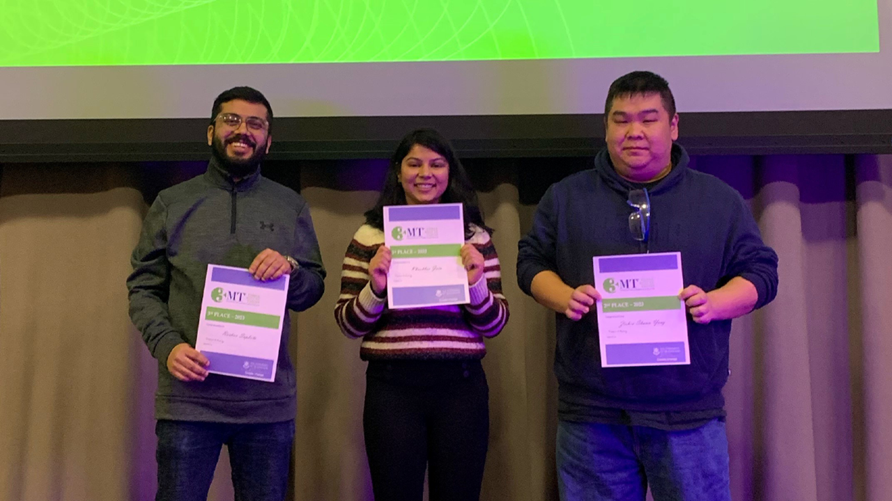 The 3 finalists for the Three Minute Thesis competition hold their award certificates.