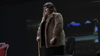 Lauren Paul, in costume, on stage in an opera production. Lauren Paul, in costume, on stage in an opera production.