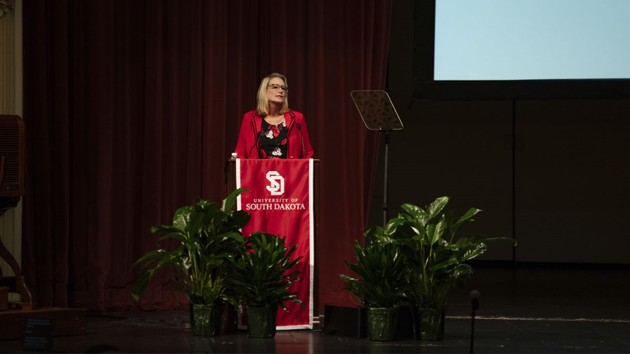 President Sheila K. Gestring delivers the 2023 State of the University. She is talking to a crowd behind a podium. President Sheila K. Gestring delivers the 2023 State of the University. She is talking to a crowd behind a podium.
