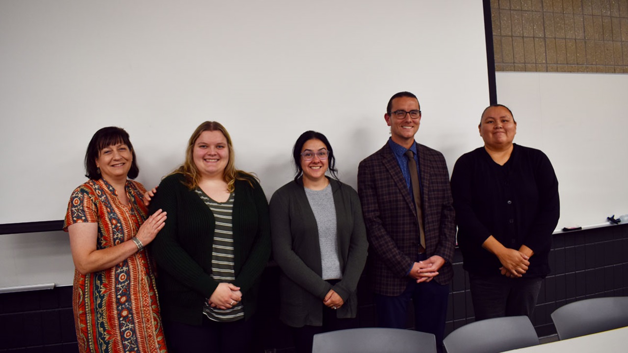 USD law students standing together in front of a white board. USD law students standing together in front of a white board.