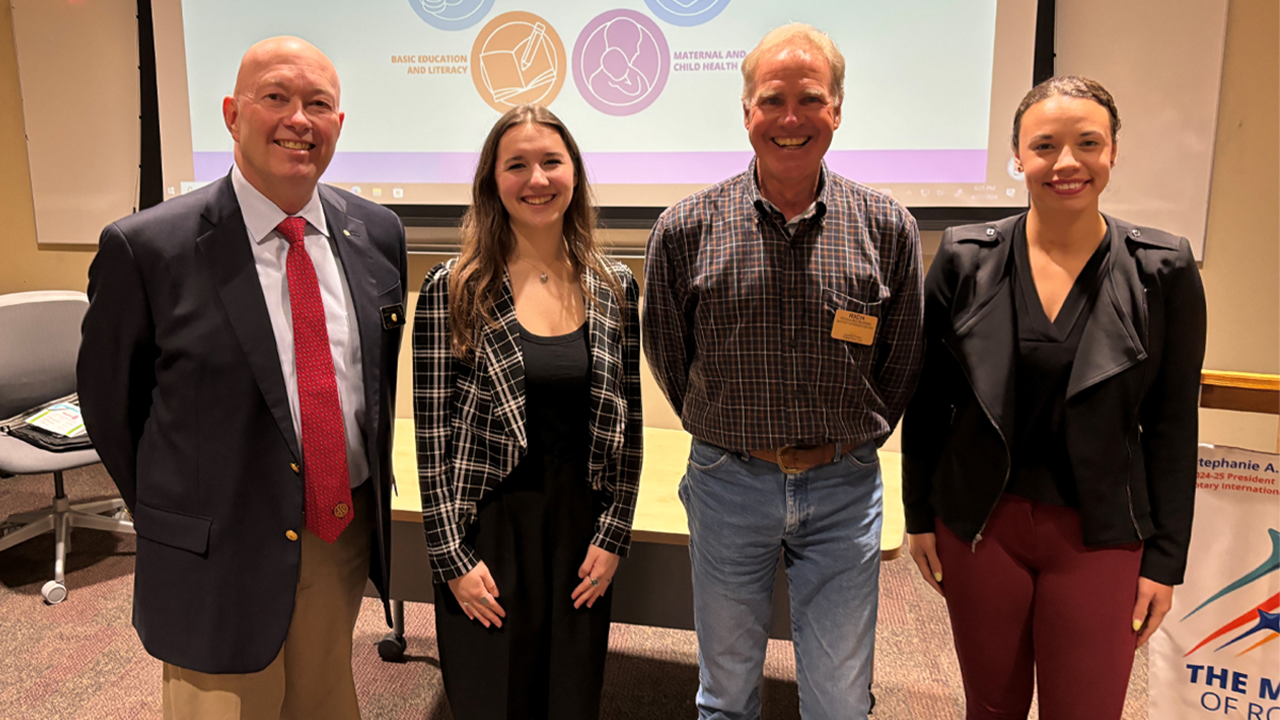 Timothy Shorn, Ryan Conover, Rich Burns and Anna Stork stand together for a photo.