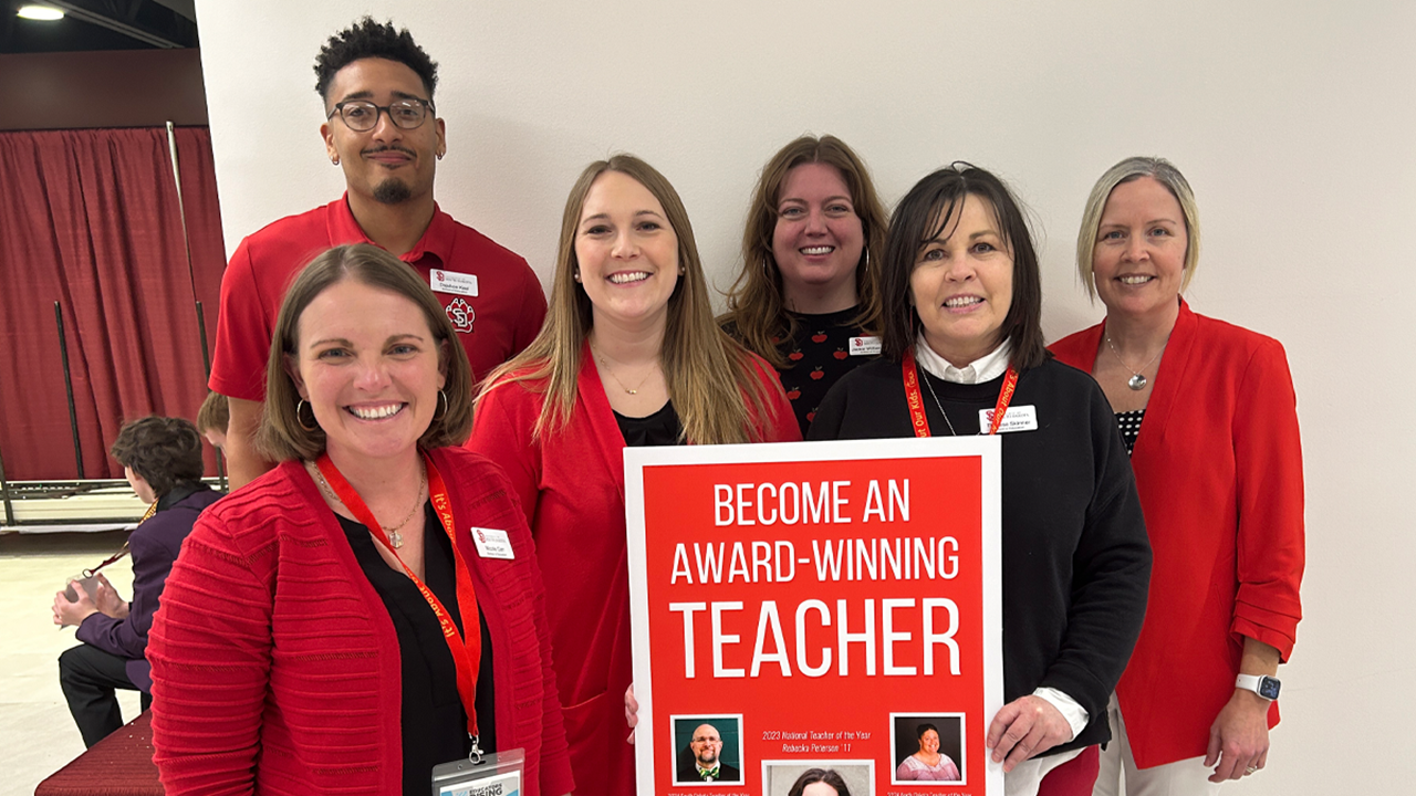 Faculty and staff from the School of Education stand together for a photo at the Educators Rising conference.