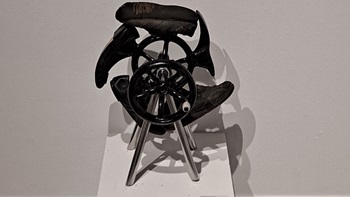 Sculpture student David Lammers' sculpture that incorporates shoe repair forms and old flywheel forms cast in iron
