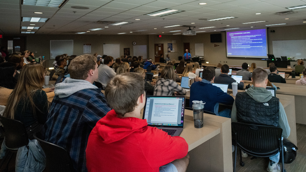 University of South Dakota students attend a lecture.