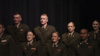A group of ROTC students at USD stand together at the graduation pinning ceremony.
