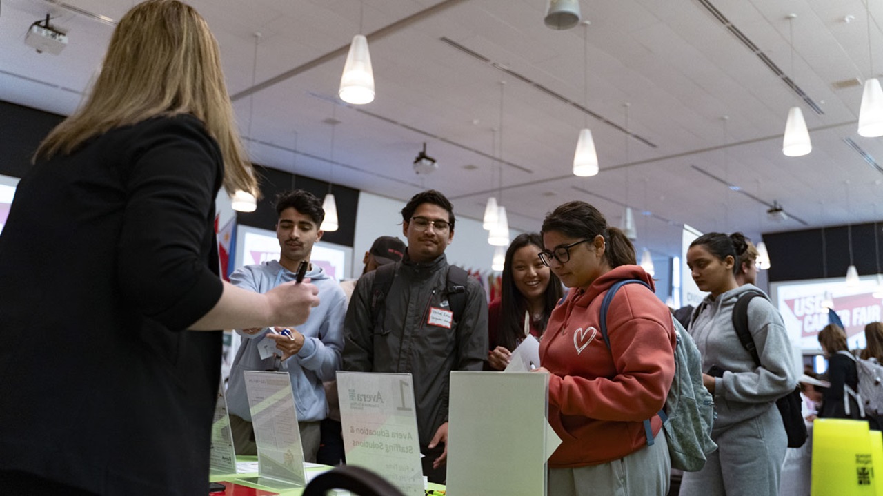 USD students talk with a representative from Avera. USD students talk with a representative from Avera.