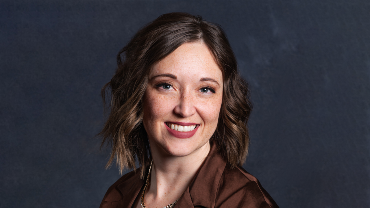 A headshot of Jenna Weir-Riedel.