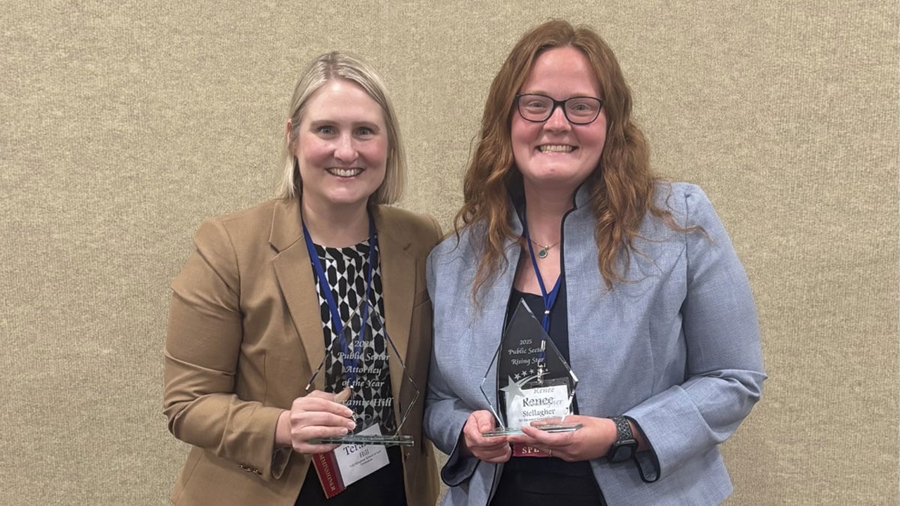 Teramie Hill ’09 J.D., and Renee Stellagher ’22 J.D., are pictured with their respective awards from the South Dakota State Bar.