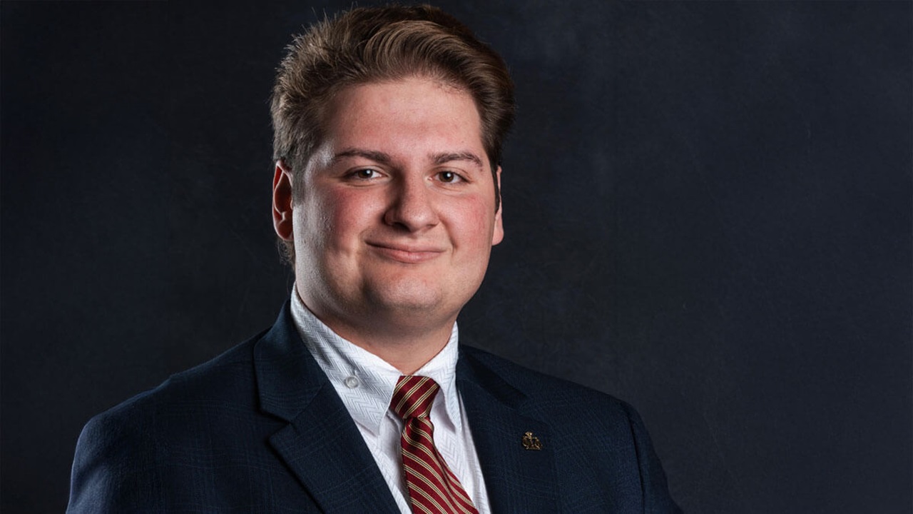 Vincent Tarallo, J.D., a 2025 Knudson School of Law graduate poses for his headshot.