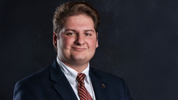Vincent Tarallo, J.D., a 2025 Knudson School of Law graduate poses for his headshot.