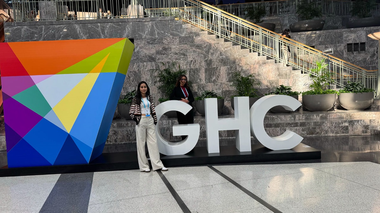 Bidya Bhattarai and Sheyma Musterih Abdikebir pose infront of the Grace Hopper Conference sign.