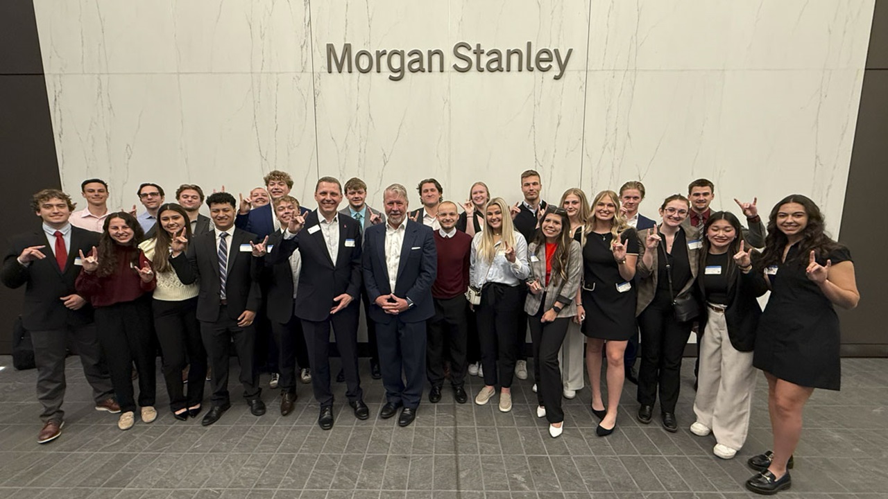 A group of USD student standing in front of the Morgan Stanley sign with Morgan Stanley leaders. A group of USD student standing in front of the Morgan Stanley sign with Morgan Stanley leaders.