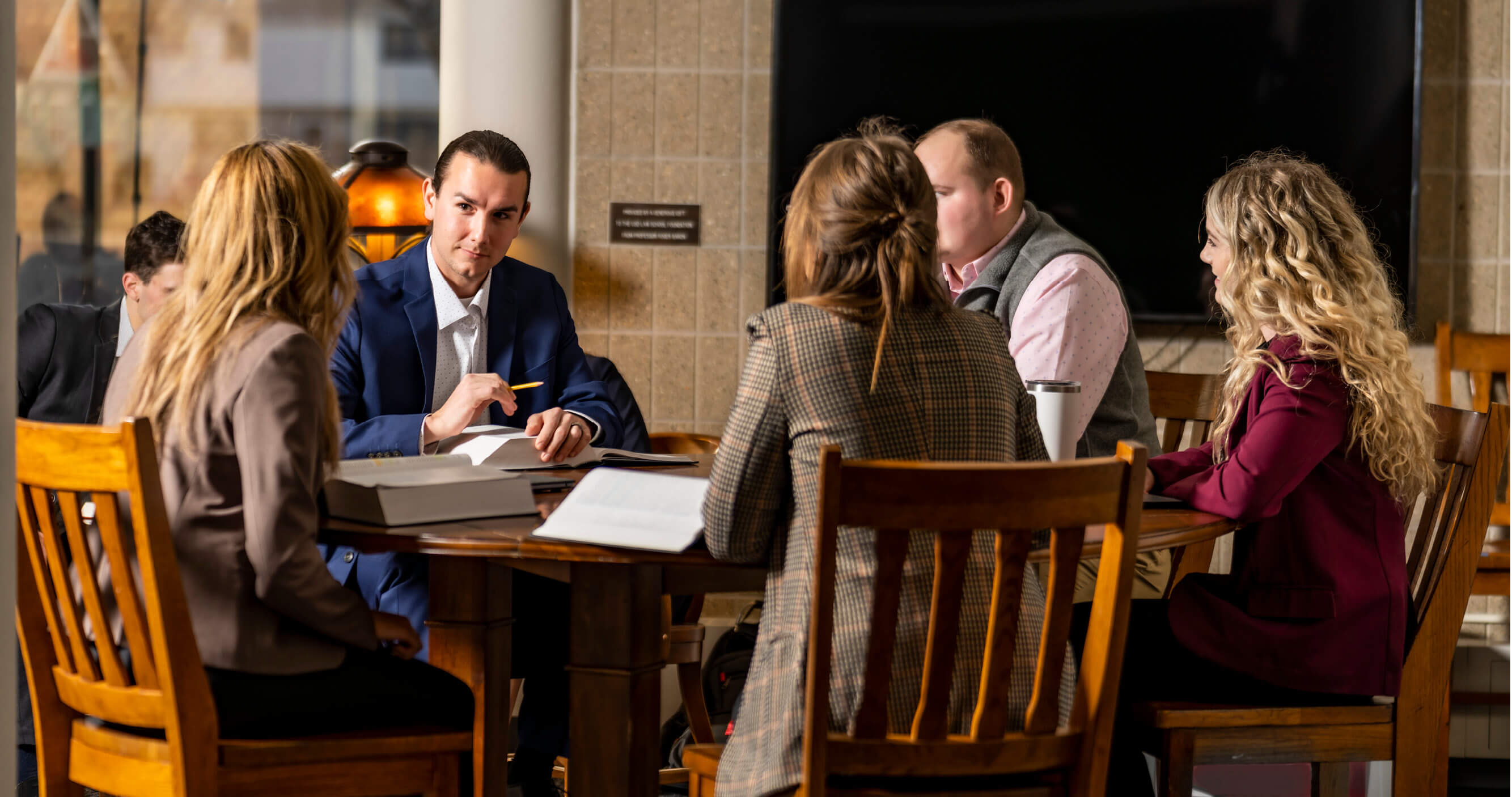 eMBA students conversing during a study session.
