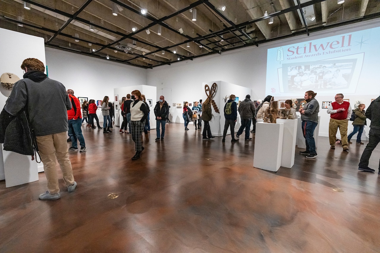Students look around the 2024 Stilwell Student Awards Exhibition.