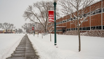 The Delzell Education Center sits on a snowy campus.