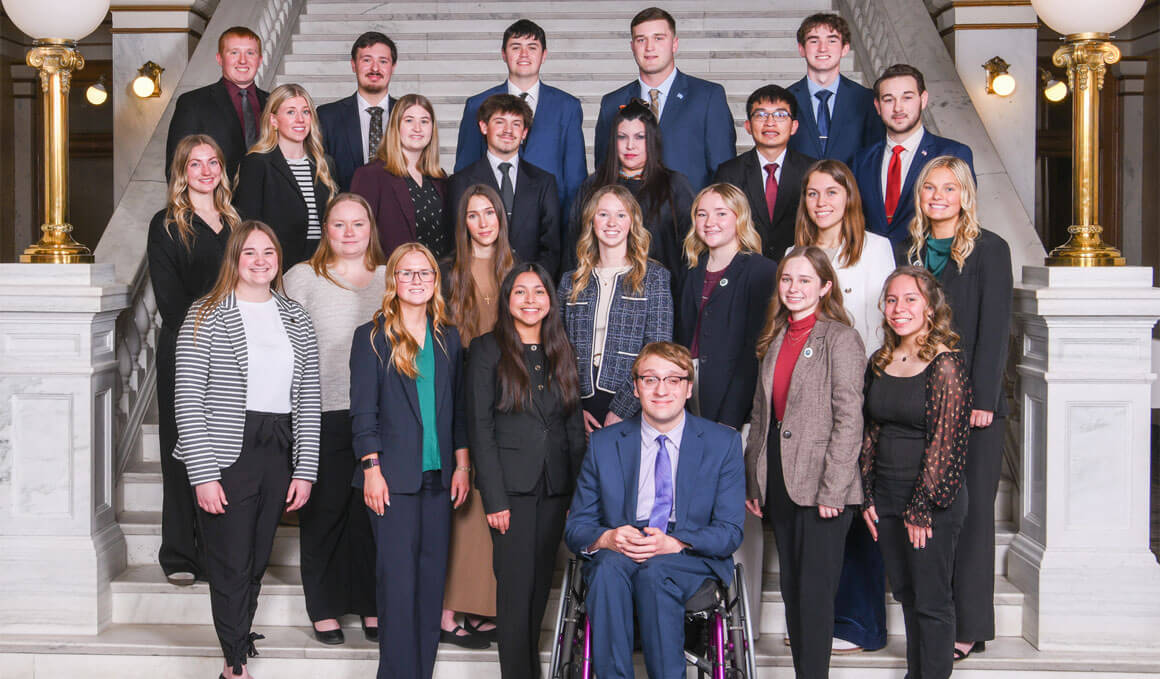 Interns, including nine USD students, stand on the marble steps in the state's capitol in Pierre, SD.