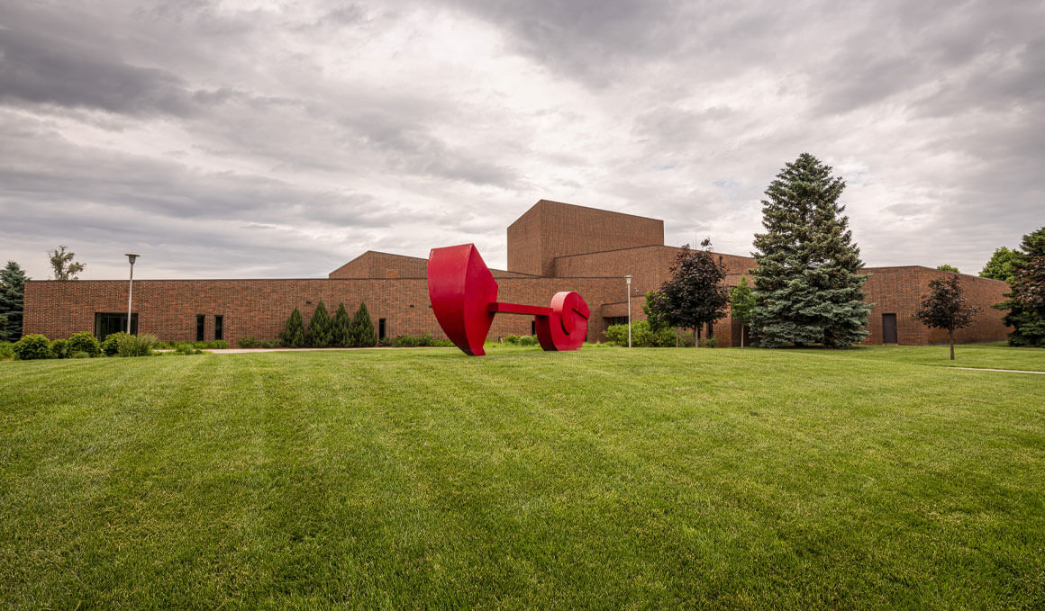 An exterior photo of the Warren M. Lee Center for Fine Arts, sitting on the USD campus on an overcast day.