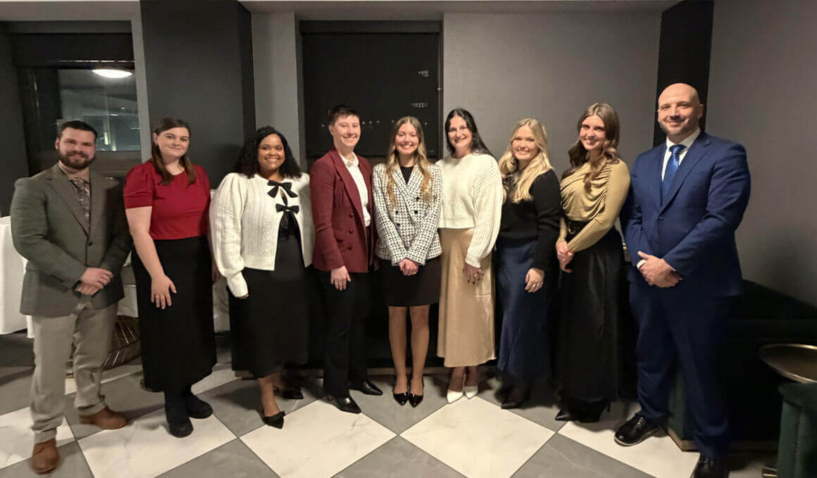 USD students from the Knudson School of Law's Public Service Pathway Pilot program stand in a room and pose for a picture.