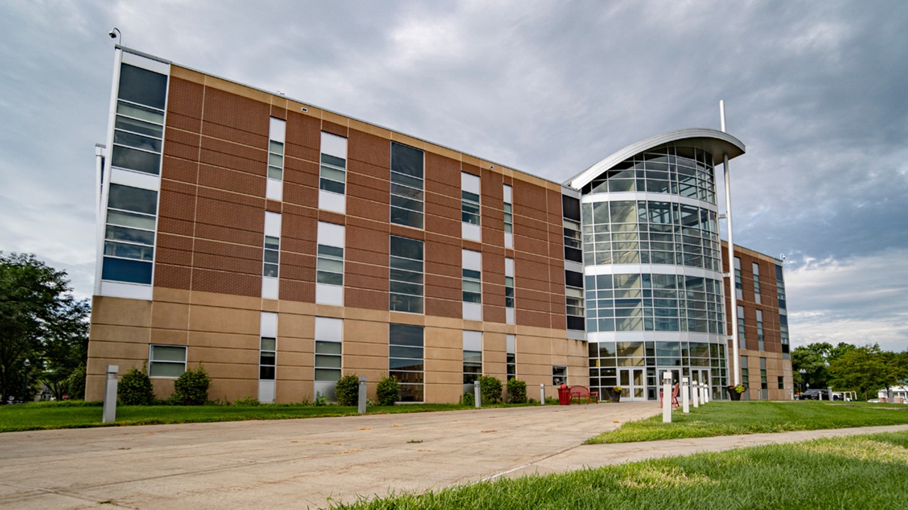 A photo of the medical school. The sky is cloudy.