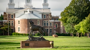 A wide shot of Legacy and Old Main in the spring. 