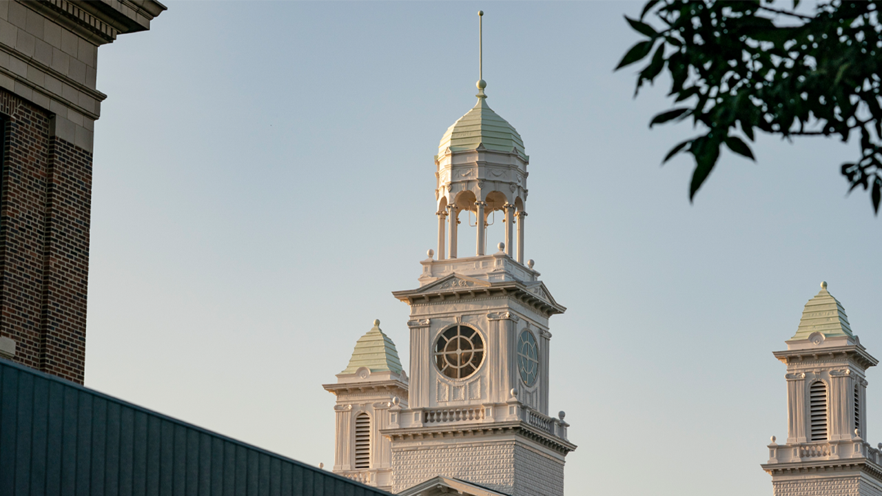 A photo of the top of the Old Main building on the University of South Dakota's campus.