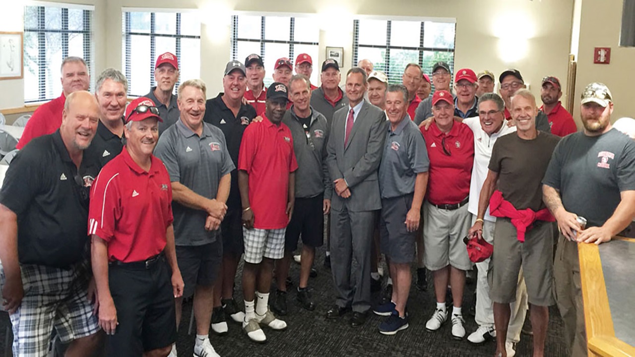 The Coyote Brotherhood standing together in a large group The Coyote Brotherhood standing together in a large group