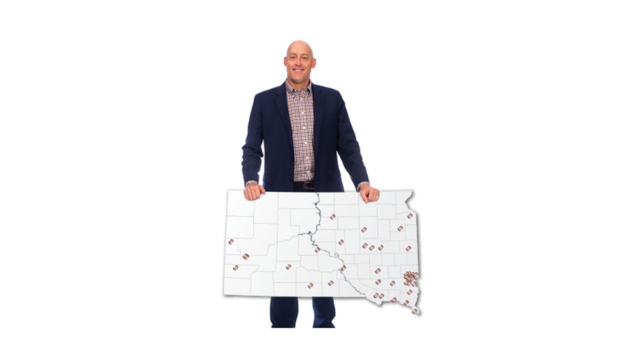 Brock Rops holding a map of South Dakota showing HOSA's impact throughout the state. Brock Rops holding a map of South Dakota showing HOSA's impact throughout the state.