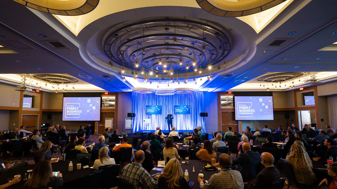 A crowd watching the keynote speaker at the Prairie Family Business Conference. A crowd watching the keynote speaker at the Prairie Family Business Conference.
