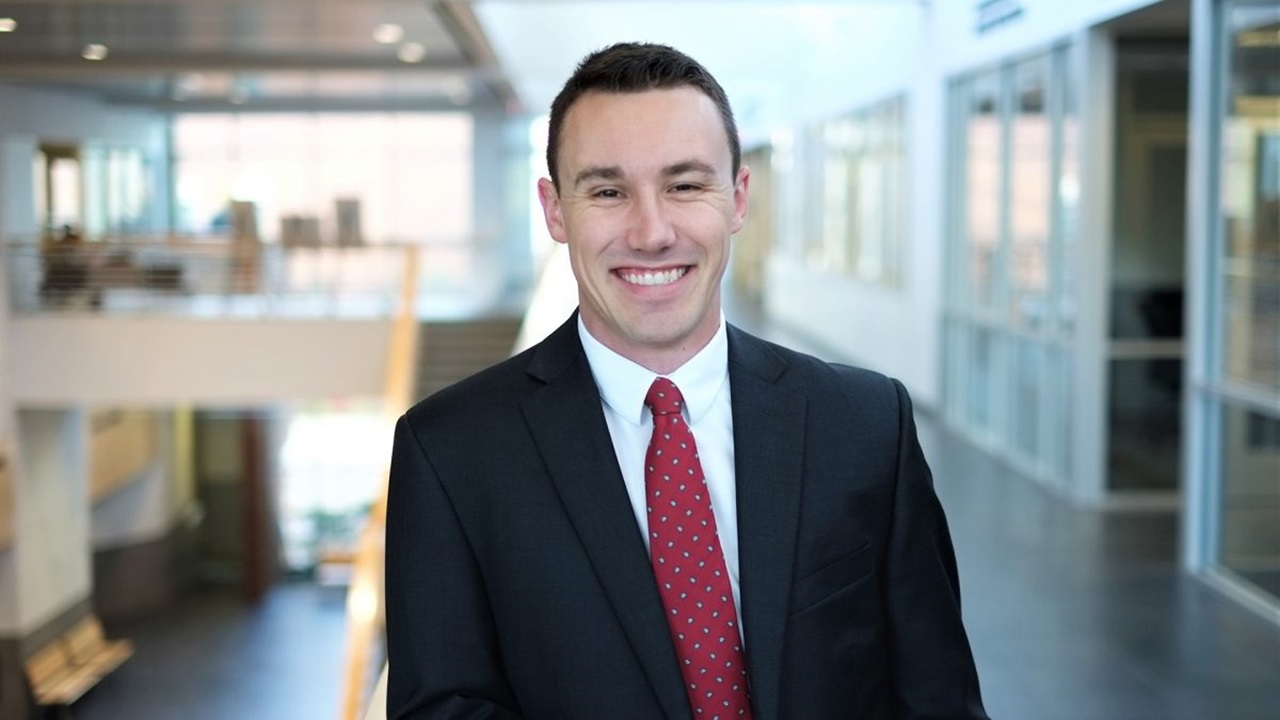 Photo of Erik Muckey in a modern business building