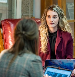 Students talking in the Law library.