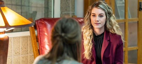 Students talking in the Law library.