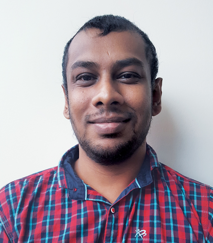 Success story Pasan Fernando smiling.