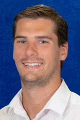 A headshot of Alec Thomas.