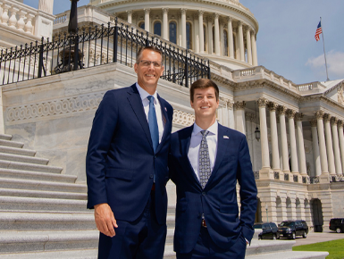 A photo of Trenton Hoekstra and Representative Randy Feenstra in front of the U.S. Congress building.
