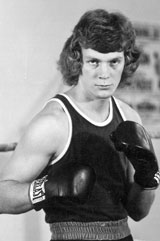 A young Jeffery LeMair wearing his boxing uniform and gloves