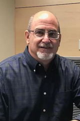 Richard Braunstein smiles for a photo. 