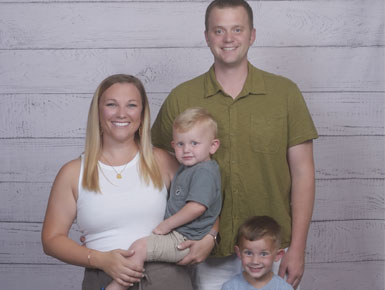 Nicole Decker, her husband Jordan, and their children Grayson and Reddik.