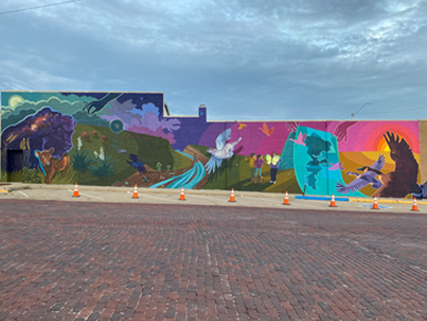A colorful mural painted on the side of a building in McCook, Nebraska. 