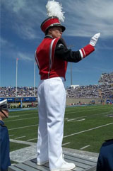 Nicole Decker as a USD student, conducting a band