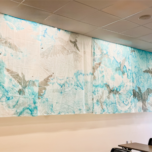 Amy Fill, USD gallery director, displays her piece Murmur(ation) in the Nettleman Classroom.