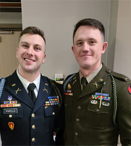 Jerrod Fedorchik poses with a friend, both are wearing military attire.