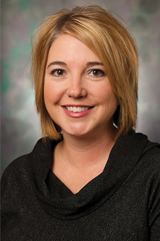 A headshot of Sue Bak. 