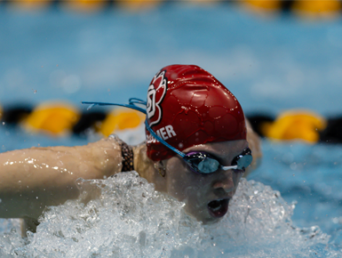 Christina Spomer participates in a swim meet competition.